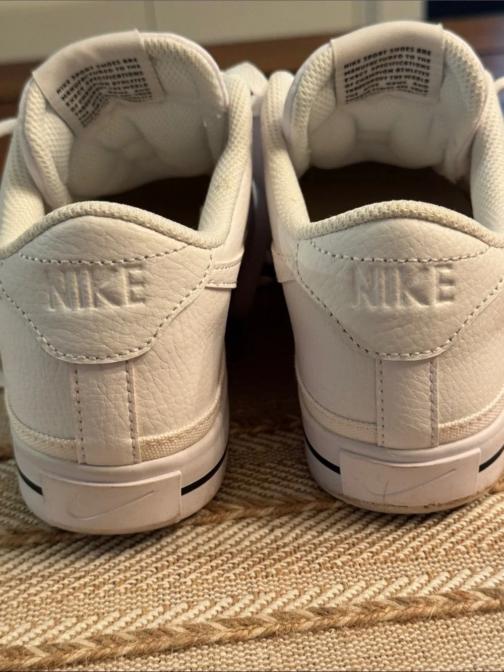 Nike White Low-Top Sneakers with Red Tongue Logo